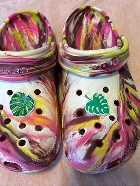 CROCS Pink Yellow White Marbled Clogs with Green Leaf Charms